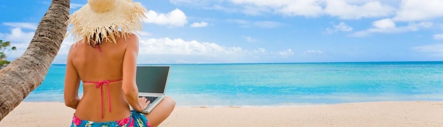 lady with laptop at beach